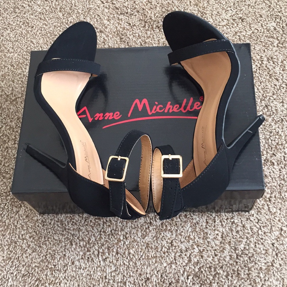 Black heels with strap around the ankle